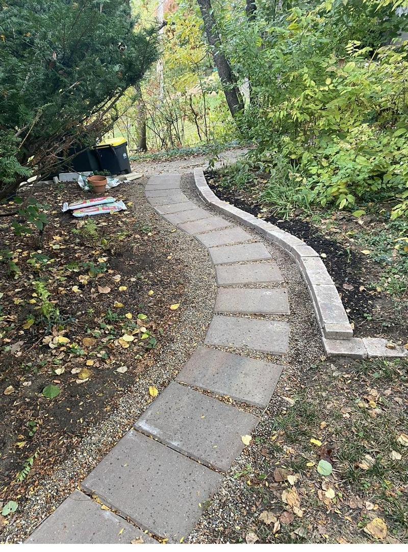 Finished paver walkway with retaining wall edge by Ryan Ras in Solon, Iowa