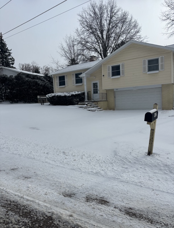 Snow-covered driveway before snow removal in Solon, Iowa